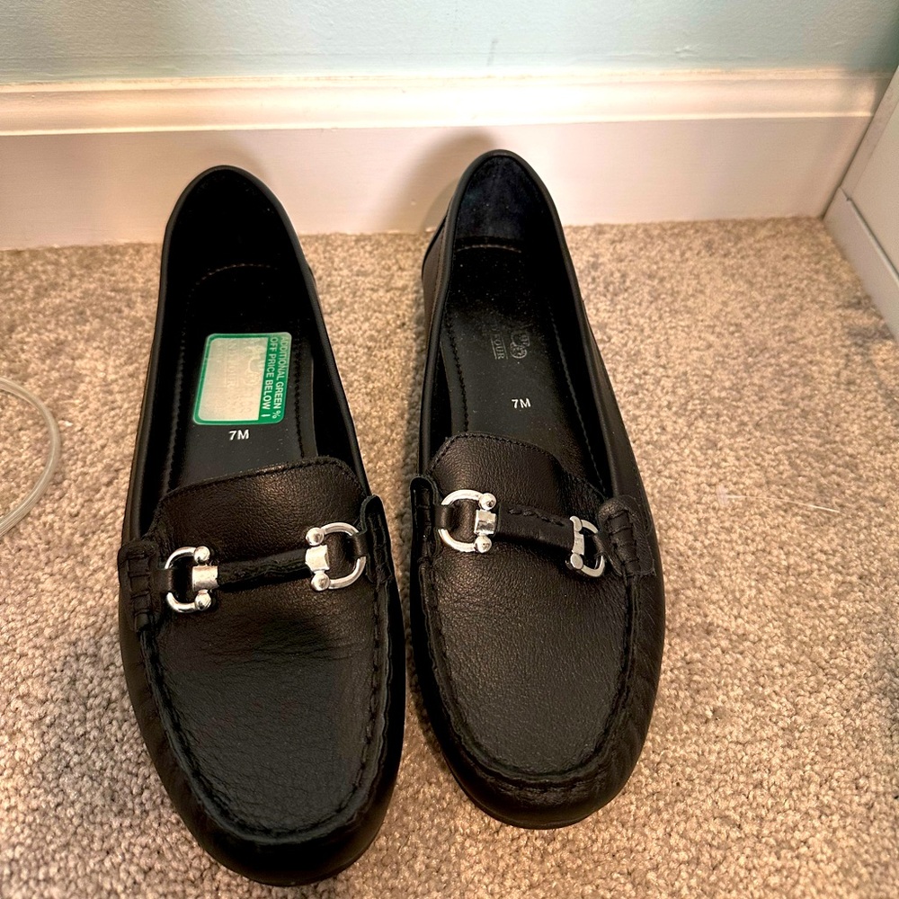 Black coach and four loafers